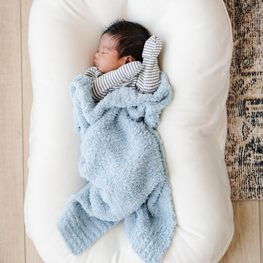 Baby boy in super soft, light blue BAMBONI® MINI BLANKETS - Saranoni
