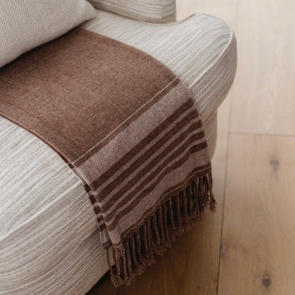 Brown chenille fringe blanket with elegant fringe, displayed on a chair - saranoni