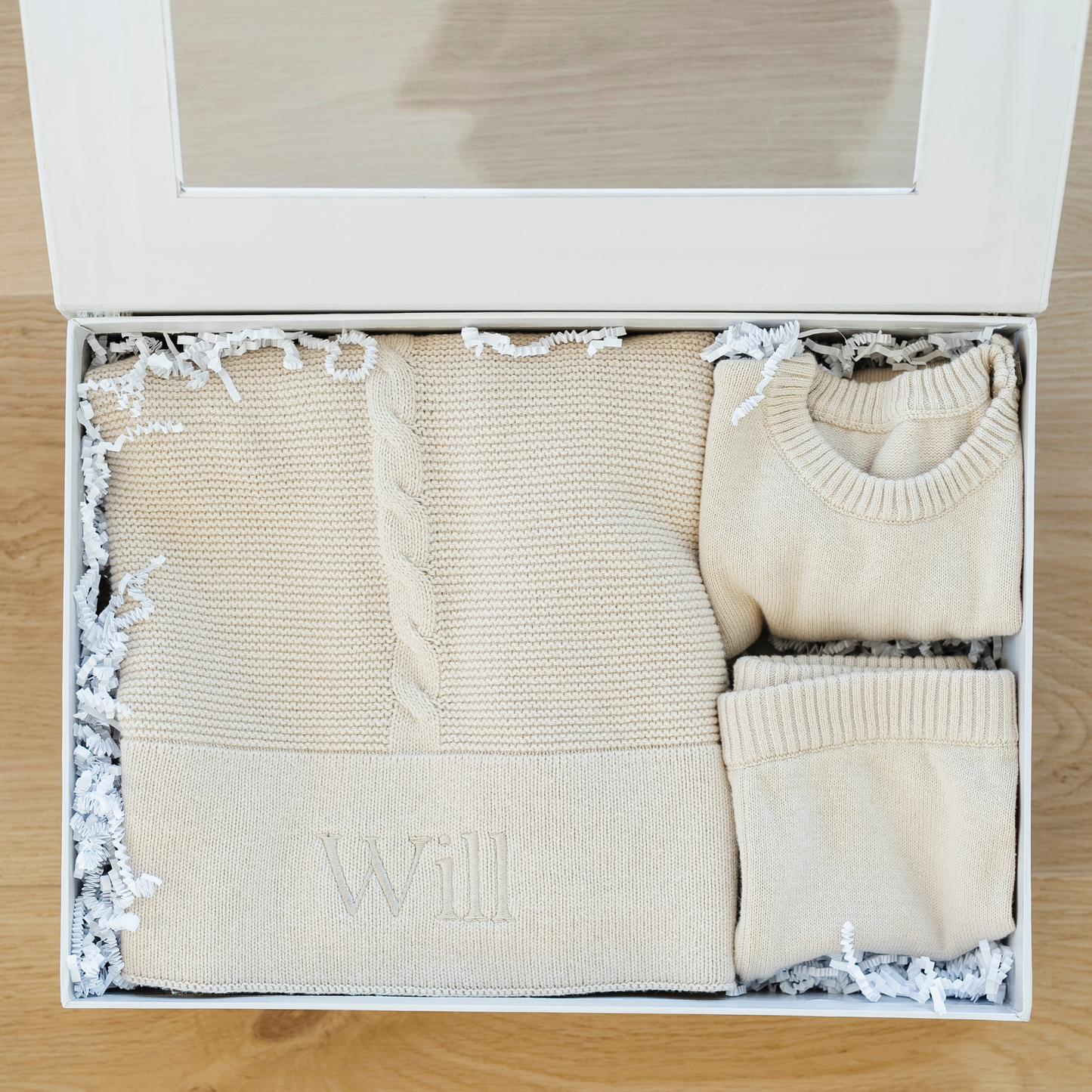 Tan baby blanket in heirloom cotton knit bundled with a beautiful matching outfit. 