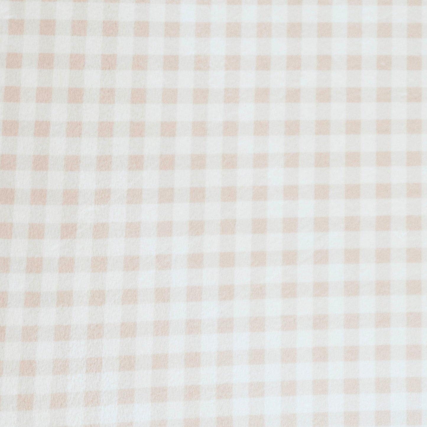 Close-up of Minky Stretch Luxe fabric in a delicate gingham pattern. Made from 94% polyester and 6% spandex, this ultra-soft, stretchy fabric is perfect for baby essentials like swaddles, changing pad covers, and crib sheets.