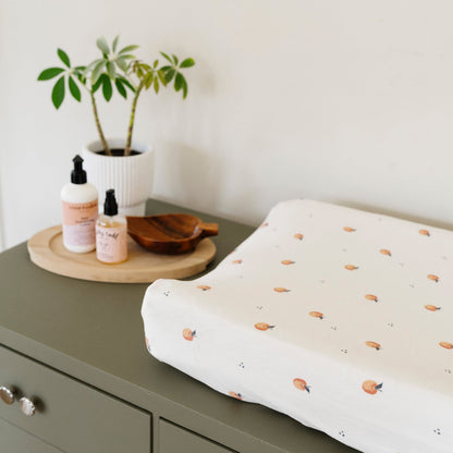 Ultra-soft Saranoni Minky Stretch Luxe changing cover in a apple pattern, crafted from 94% polyester and 6% spandex for extra stretch and durability. Perfect for any baby nursery, this breathable, stretchy changing pad cover ensures a snug fit while adding a touch of style. Ideal for parents seeking high-quality baby essentials that are soft, luxurious, and easy to care for – wash cold, no softeners, hang or lay flat to dry.