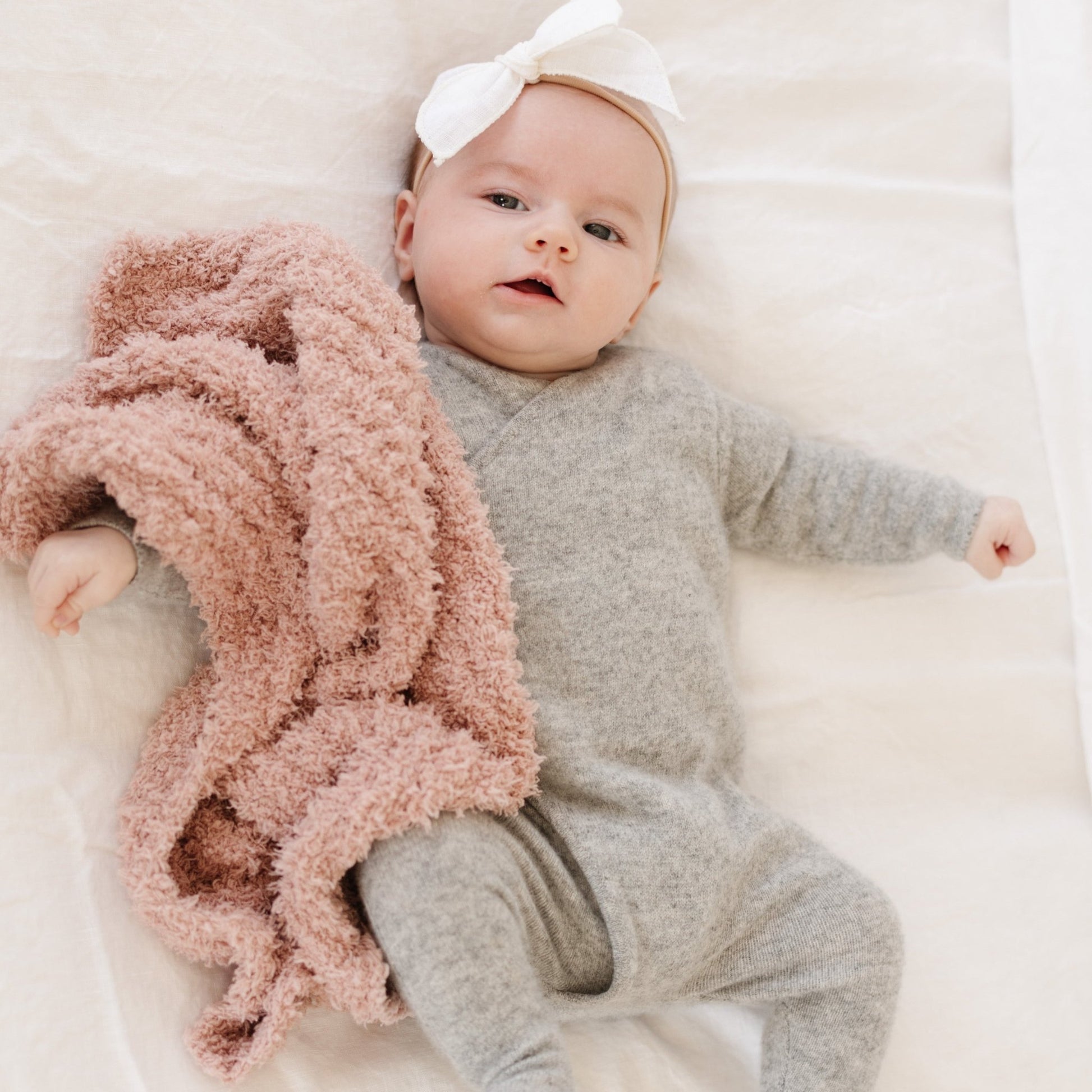 Adorable baby with soft and tiny Sunkissed RIBBED BAMBONI MINI BLANKETS - Saranoni